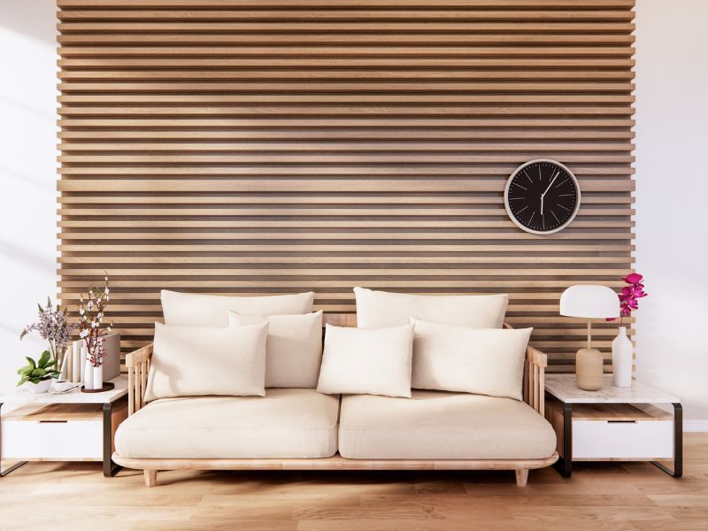 DIY accent wall ideas: a cozy living room with a modern wood-paneled accent wall, adding warmth and texture to the space